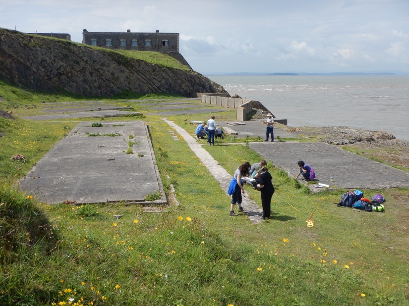 Volunteers undertaking on the Nissan Hut bases at Brean Down, July 2016
