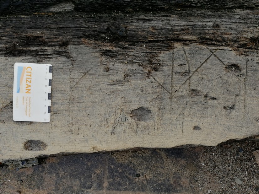 Possible shipwrights marks on the ouside face of the hull planking