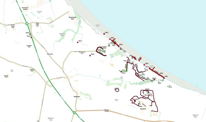 Aerial photograph interpretation plotted into GIS software. The red and black lines indicate barbed wire obstacles, with green lines indicating slit trenches. The single red icons indicate pillboxes a