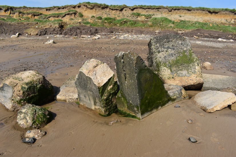 Structural remains undermined by erosion