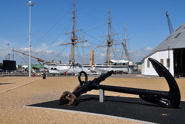 An anchor and HMS Gannet at Chatham Dockyard