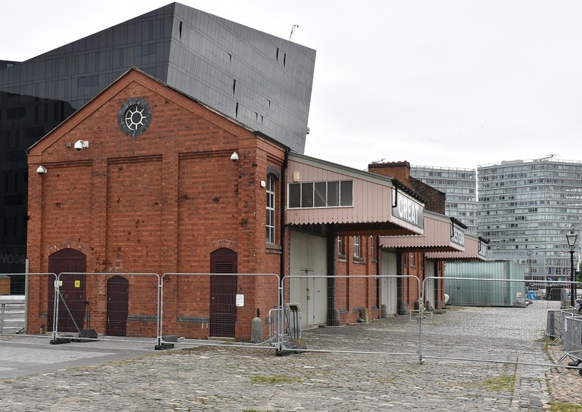 Bomb splinter damage to the side of the Great Western Railway building, Canning Dock