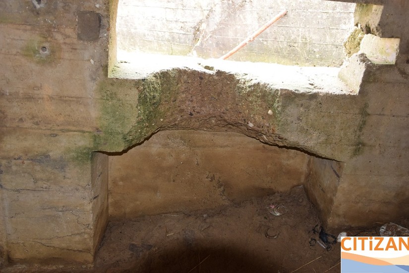 Recess chipped into area below embrasure
