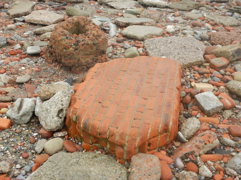 A section of brick-built wall on the foreshore