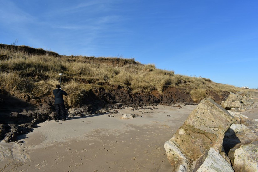 The eroding boulder clay with fractured anti-tank wall in the foreground.